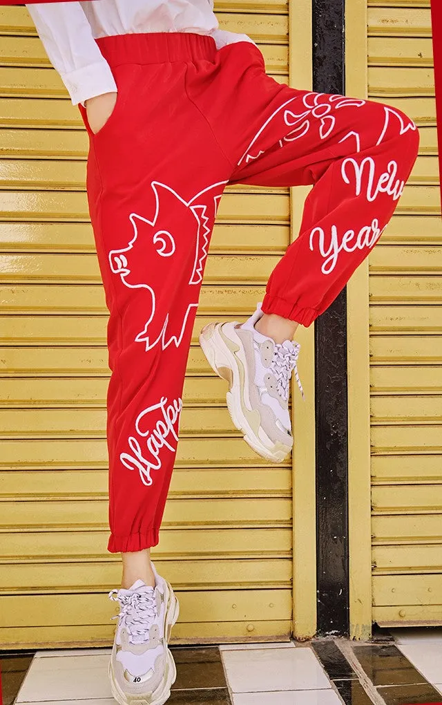 MAXIMARTIN MIXED PATTERN NEW YEAR RELAXED JOGGER PANTS IN RED